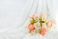 Pastel Artificial Pink Rose Wedding Bridal Bouquet on white fur Royalty Free Stock Photo