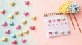 Pastel background with various heart shaped items scattered around Royalty Free Stock Photo