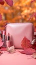 Pastel beauty scene Pink clutch, makeup essentials, and fall foliage