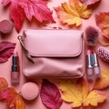 Pastel beauty scene Pink clutch, makeup essentials, and fall foliage