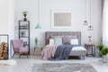 Pastel bedroom with comfortable chair Royalty Free Stock Photo