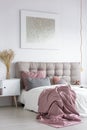 Pastel bedroom with grey painting