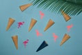 pastel blue background with ice cream zone of which one is blue zone and paper flamingos