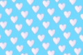 Pastel blue background with white hearts pattern. Minimal love art design