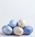 Pastel blue and gold Easter eggs arranged with copy space Royalty Free Stock Photo