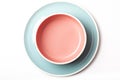 Pastel blue plate and pink bowl on white background Royalty Free Stock Photo