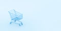 Pastel blue shopping cart on blue background. Black Friday sales minimalistic concept