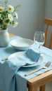 Pastel blue table setting, linen cloth on wooden tabletop , setting, rustic, blue Royalty Free Stock Photo