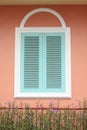 Pastel blue window with white frame on pink wall Royalty Free Stock Photo