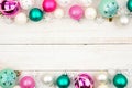 Pastel Christmas bauble double border over white wood Royalty Free Stock Photo