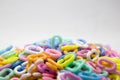 Pastel color of plastic chains on white background