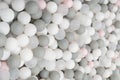 Pastel color white, grey, blue plastic balls background for baby activity. Kid's playing room interior. Copyspace