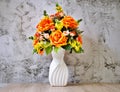 Pastel colored artificial flowers bouquet in pot on table, copy space for text or lettering pretty background or wallpaper Royalty Free Stock Photo