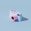Pastel Pink and Blue Retro Digital Camera on Light Background Royalty Free Stock Photo