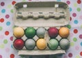 Pastel colored easter eggs with feather