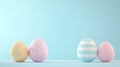 Pastel colored Easter eggs with polka dots and waves on soft blue background Royalty Free Stock Photo