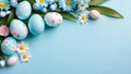 Pastel colored Easter eggs and spring flowers on blue background.Top view, flat lay.Easter banner for design with copy space. Royalty Free Stock Photo