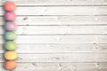 Pastel colored eggs on white wooden planks, easter background Royalty Free Stock Photo