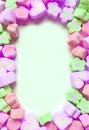 Pastel Colored Frame of Flower and Heart Shaped Marshmallow Candies Royalty Free Stock Photo