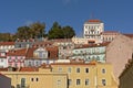 Pastel colored houses and apartment buildings on a hill of Lisbon