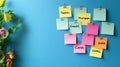 Pastel-Colored Sticky Notes with Financial Reminders on a Blue Background with Copy Space Royalty Free Stock Photo