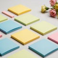 Pastel colored sticky notes are neatly arranged in a grid pattern on a Royalty Free Stock Photo