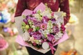 Pastel colors bouquet made of orchids, Freesia, Carnation and Limonium flowers