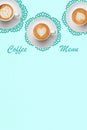 Pastel colors coffee menu with three white porcelain cappuccino cups on green napkins in vintage style. Hearts latte art. Royalty Free Stock Photo