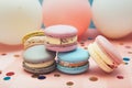 Pastel colors macaron cakes on blue and pink background with air balloons and decoration