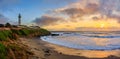 Pastel colors of sunset and silky water from long exposure of waves crashing by Pigeon Point Lighthouse on Northern California Royalty Free Stock Photo