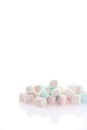Pastel colourful marshmallows isolated in white background