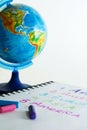 Pastel crayons and globe. Royalty Free Stock Photo