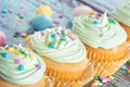 Pastel Easter cupcakes with candy and sprinkles Royalty Free Stock Photo