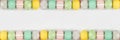 Colorful Easter banner with double row border of Easter Eggs over a white background with copy space Royalty Free Stock Photo