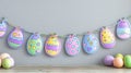 Pastel Easter Egg Garland and Eggs on Wooden Surface Royalty Free Stock Photo