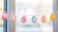 Pastel Easter Egg Garland Hanging in Window Royalty Free Stock Photo