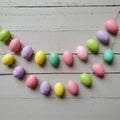 Pastel Easter Egg Garland on Wooden Background Royalty Free Stock Photo