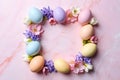 Pastel easter eggs arranged with spring flowers on marble Royalty Free Stock Photo