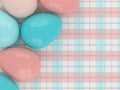 Pastel Easter eggs lying on plaid pattern Royalty Free Stock Photo