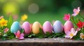 Pastel easter eggs nestled amongst vibrant spring blossoms on a rustic wooden surface, symbolizing renewal and springtime joy. Royalty Free Stock Photo