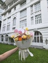 Pastel Flower Bouquet Against White Heritage Facade Royalty Free Stock Photo