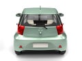 Pastel green small urban compact car - tail view Royalty Free Stock Photo