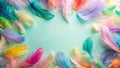 A pastel-hued collection of soft feathers arranged in a circular frame on a light-aqua background, creating a delicate and airy Royalty Free Stock Photo