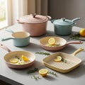 Pastel kitchenware collection featuring pots pans and skillets with lemon slices Royalty Free Stock Photo