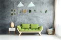 Pastel lamps above green sofa Royalty Free Stock Photo