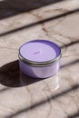 Pastel lavender round candle tin mockup on marble tabletop Royalty Free Stock Photo