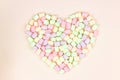 Pastel multicolor heart shape marshmallow put on pastel pink background. Food background. Holiday and celebration concept
