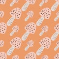 Pastel mushroom ornament seamless pattern. Doodle wild print with orange background and light pink elements Royalty Free Stock Photo