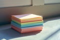 Pastel paper stack basking in sunlight, office organization essential Royalty Free Stock Photo