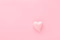 Pastel pink background with a heart with copy space